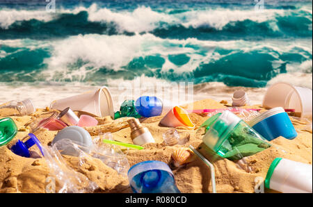 Plastic waste pollutes a wonderful sandy beach Stock Photo