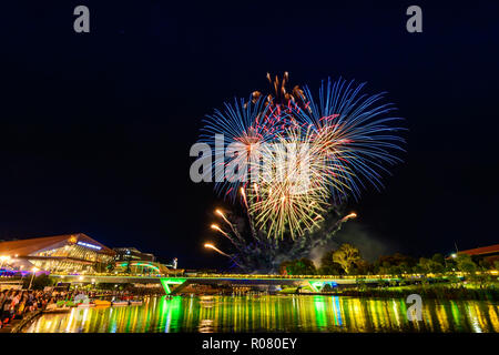 Adelaide, Australia - January 26, 2018: Australia Day fireworks on display in Elder Park viwed across Torrens river at night Stock Photo