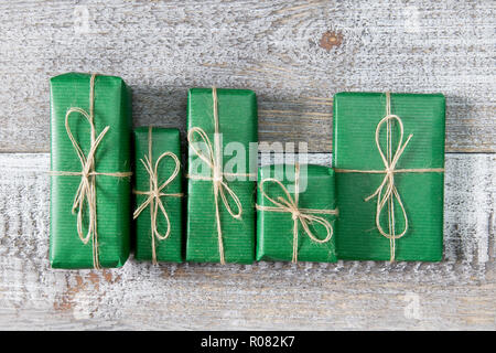Presents in gift boxes on wooden frame background. Flat lay, top view Stock Photo