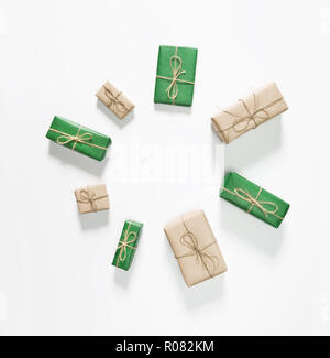 Christmas green and brown gift boxes on white background. Flat lay, top view Stock Photo