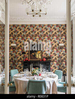 Set table in eclectic dining room Stock Photo