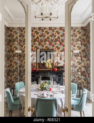 Set table in eclectic dining room Stock Photo