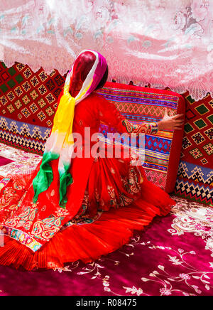 Qashqai girl in her traditional tent, Semirom county, Isfahan province, Iran. Ghashghai are the most famous nomadic tribes of Iran. Stock Photo