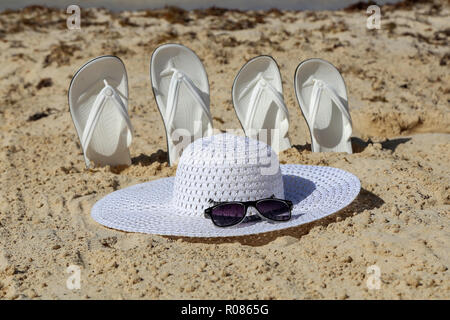 White flip-flops, bath sandals made of plastic with thong bridge and  diagonal strap fastening, brand Havaianas Stock Photo - Alamy