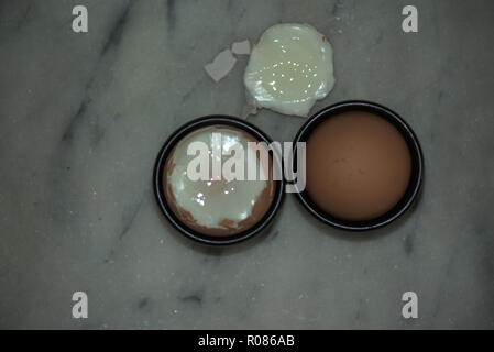 Two soft boiled eggs in egg cups Stock Photo