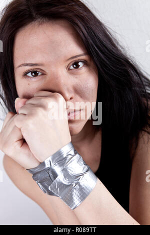 kidnapped young woman, hostage closeup Stock Photo
