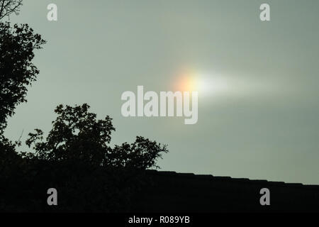 A bright colorful parhelion or sundog in the sky Stock Photo