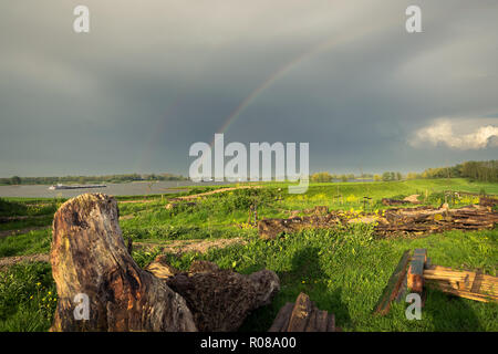 Rainbow over the river Rhine, The Netherlands Stock Photo