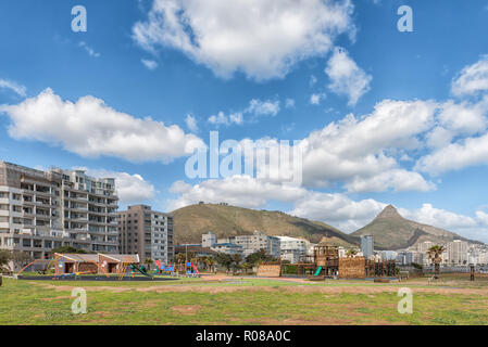 CAPE TOWN, SOUTH AFRICA, AUGUST 17, 2018: A childrens playground at Mouille Point in Cape Town in the Western Cape Province. Apartment buildings, Sign Stock Photo