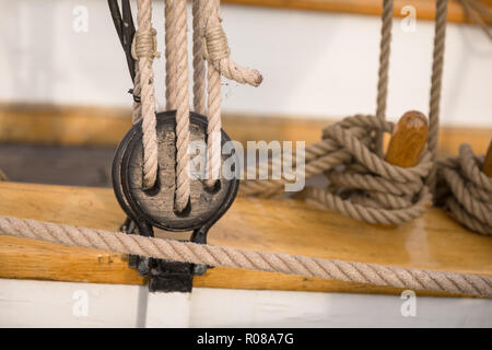 Pulley for sails and ropes made from wood on an old sail boat Stock Photo