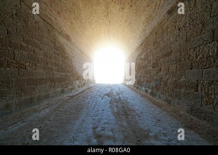 Inside a tunnel with bright light at the end, natural scene, L'Ametlla de Mar, Tarragona, Catalonia, Spain Stock Photo