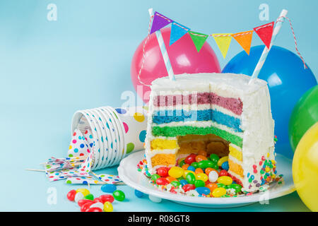 Rainbow pinata cake with candies - birthday background, card, concept - copy space Stock Photo