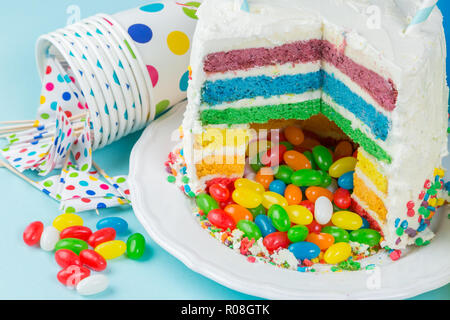 Rainbow pinata cake with candies - birthday background, card, concept - copy space Stock Photo