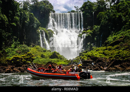 Speed boat rides under the water cascading over the Iguacu falls in Iguacu, Brazil on 18 February 2008 Stock Photo
