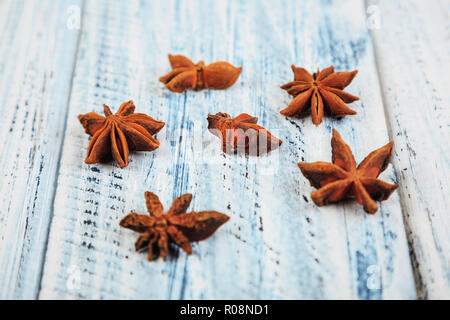 dried star anise flowers on light wooden table Stock Photo