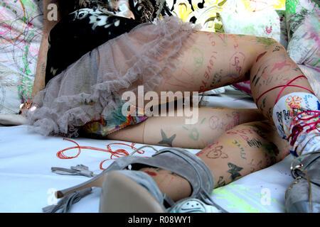 A model wears 'punk rock' inspired tights as part of a fashion show in a gallery in Berlin. Stock Photo