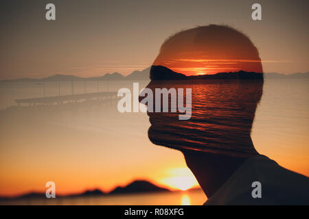 Man, sunset and sea. Psychotherapy concept. Multiple exposure. Stock Photo