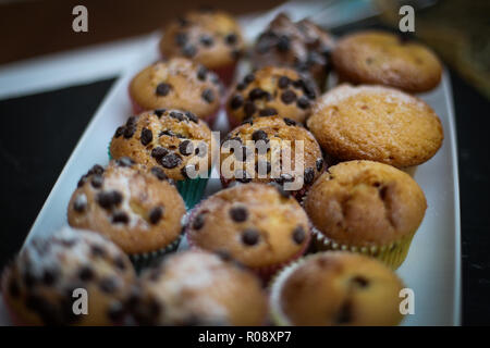 Details of chocolate chips muffins on a plate Stock Photo