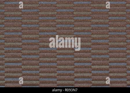 Multi-colored woven section of brown fabric showing horizontal bar patterns. Stock Photo