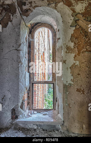 Looking out of an old crumbling Church window in Urban Detroit. Stock Photo