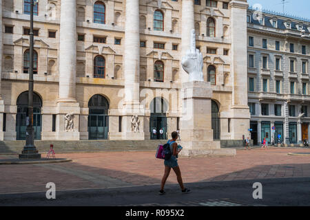 Milan, Italy - 14.08.2018: Middle finger sculpture at Piazza Affari, symbol of freedom. Stock Photo