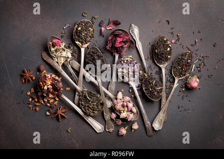 Various tea in vintage spoons. Black, green and red tea. Top view Stock Photo
