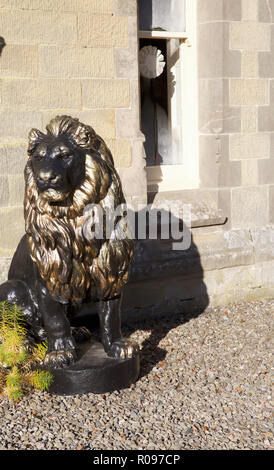 Huge lion sculptures outside The Hall at Abbey-Cwm-Hir Stock Photo