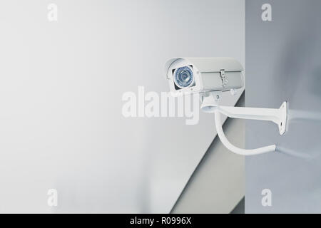 CCTV security camera on wall in the home office for surveillance monitoring home guard system. Stock Photo
