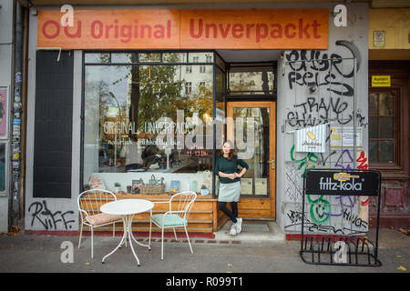 Berlin, Germany. 02nd Nov, 2018. Milena Glimbovski, founder and managing director of the shop 'Original Unverpackt' is standing in the entrance door shortly after opening the shop. For her commitment to the environment, she was named Berlin entrepreneur of the year. Their store, opened four years ago, sells food without repackaging for a more sustainable shopping experience. Credit: Gregor Fischer/dpa/Alamy Live News Stock Photo