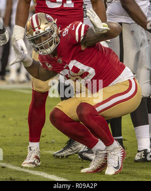 Santa Clara, California, USA. 17th Nov, 2019. San Francisco defensive  tackle DeForest Buckner (99)San Francisco 49ers defensive end Arik Armstead  (91) celebrate there take down of Cardinals quarterback Kyler Murray during  the