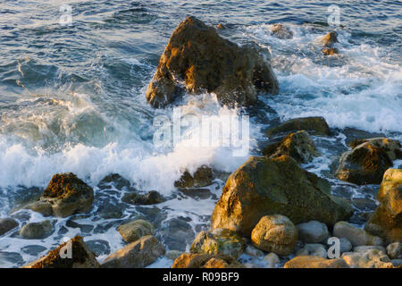 Portland, UK. 2nd October 2018. Waves crash against rocks in unseasonably warm weather on Chesil Beach, Isle of Portland Credit: stuart fretwell/Alamy Live News Stock Photo