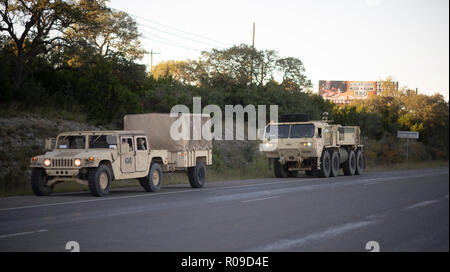 United States Army convoy carries troops and supplies to the U.S.-Mexico border on orders of Pres. Donald Trump. The president sent troops to the border in response to his perception of a group of refugees, fleeing violence and poverty in Honduras and trying to reach the relative safety of the United States, as a national security threat. Stock Photo