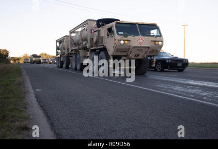 United States Army convoy carries troops and supplies to the U.S.-Mexico border on orders of Pres. Donald Trump. The president sent troops to the border in response to his perception of a group of refugees, fleeing violence and poverty in Central America and trying to reach the relative safety of the United States, as a national security threat. Stock Photo