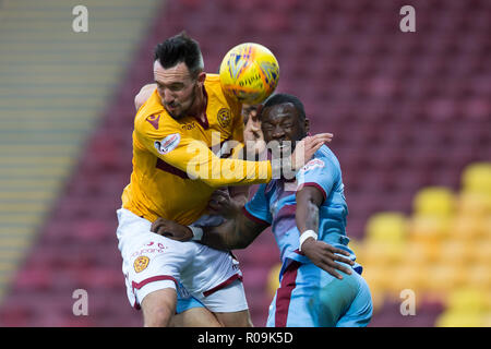 Fir Park, Motherwell, UK. 3rd Nov, 2018. Ladbrokes Premiership football, Motherwell versus Dundee; Genserix Kusunga of Dundee competes in the air with Ryan Bowman of Motherwell Credit: Action Plus Sports/Alamy Live News Stock Photo