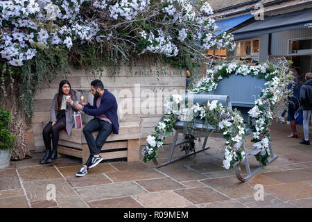 Bicester Village, 3rd November 2018. Weather cold and dry for shoppers, some getting in early for Christmas at Bicester Village outlet shopping centre on the outskirts of Bicester in Oxfordshire, England. Most of its stores are in the luxury goods and designer clothing sector. Credit: Keith J Smith./Alamy Live News Stock Photo