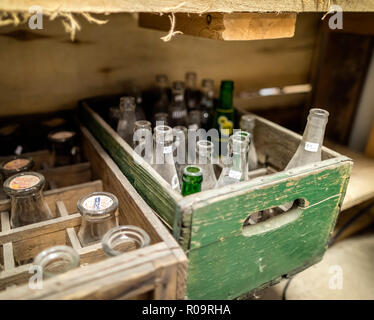 Old bottles in a wooden box at a Flea Market, Manitoba, Canada. Old bottles in a wooden box at a Flea Market, Manitoba, Canada.