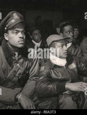 Members of 332nd Fighter Group Attending a Briefing, from left to right: Robert W. Williams, Ottumwa, IA, Class 44-E; William H. Holloman, III, St. Louis, Mo., Class 44; Ronald W. Reeves, Washington, D.C., Class 44-G; Christopher W. Newman, St. Louis, MO, Class 43-I; Walter M. Downs, New Orleans, LA, Class 43-B, Ramitelli, Italy, Toni Frissell, March 1945 Stock Photo