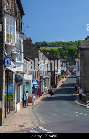 Summer view of Pateley Bridge High Street, with shops Along each side of the road of this traditional town centre Stock Photo