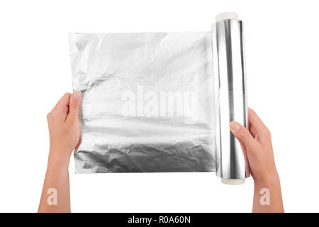 woman holding a roll of aluminum foil Stock Photo