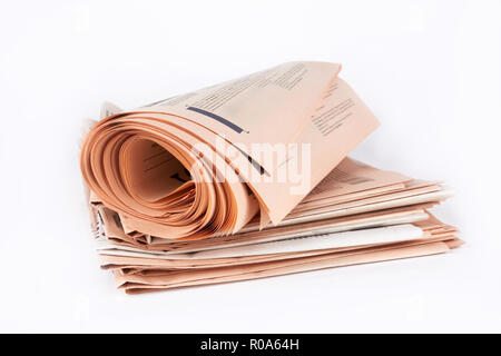 Roll of newspapers, on a white background Stock Photo