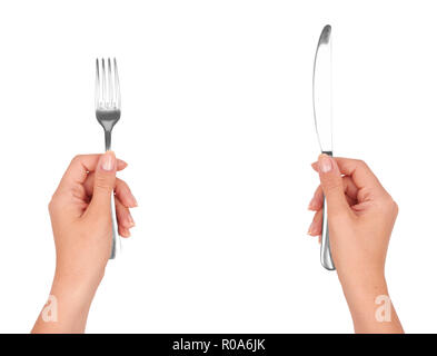 A knife and fork in womans hands. Isolated on white. Stock Photo