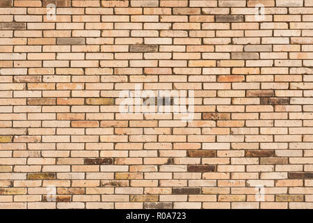 Faded brick wall background. Colored bricks facade. Stock Photo