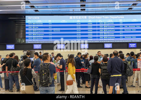 People lining up for tickets in High Speed Rail Station, West Kowloon, Kowloon, Hong Kong Stock Photo