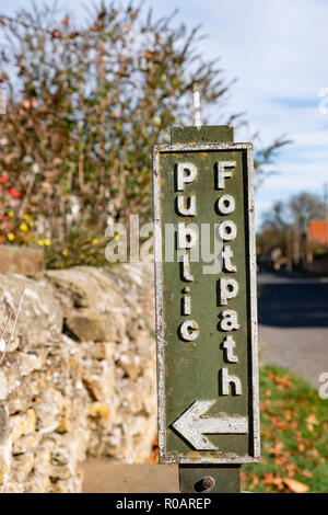 Public Footpath Sign in the Village of Hutton Buscel, North Yorkshire, England. Stock Photo
