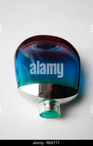 Glossy glass perfume bottle isolated on white background Stock Photo