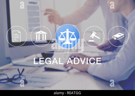 Legal advice and lawyer consulting service, concept with icons of justice, court, law, contract and in background two consultant working on document o Stock Photo