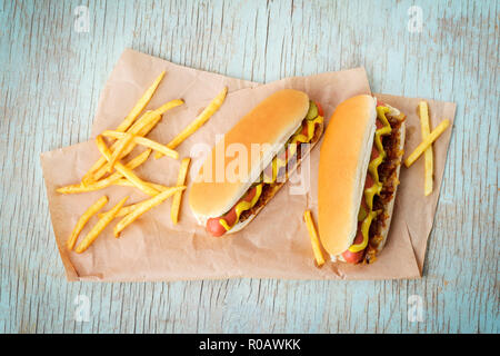 Hot dogs on wooden background Stock Photo