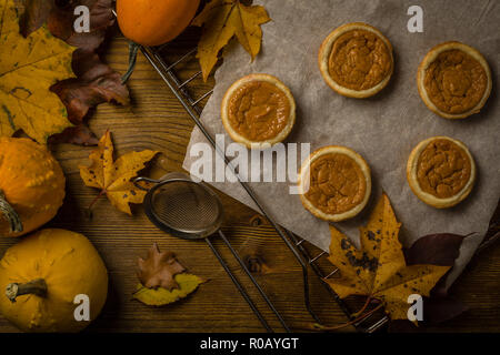 Thanksgiving concept - making mini pumpkin pies, top view Stock Photo