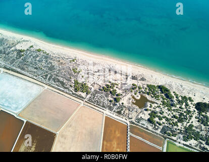 Aerial panoramic birds eye view Nature Reserve of Santa Pola Salt Lakes. Drone photo salt production marshy area and sandy coastline Mediterranean Sea Stock Photo