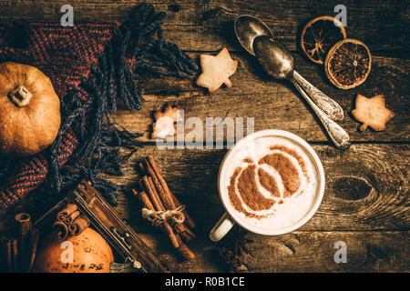 Autumn pumpkin spice latte on rustic wood background, top view Stock Photo